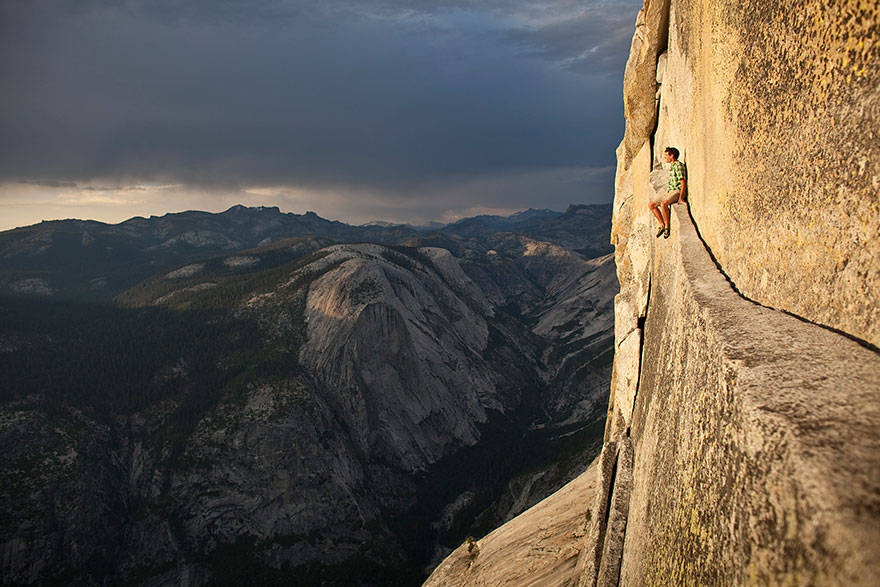 Alex Honnold, one of the world's most daring free-climbers, resting in the middle of a climb.