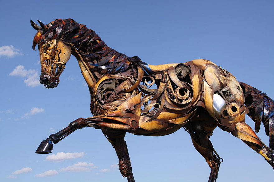 Scrap metal sculptor, bronze sculptor by john lopez, john lopez, metal recycle idea, lemmon, scrap metal sculptor in south dakota, western style sculptures, sculptures using old farm equipment