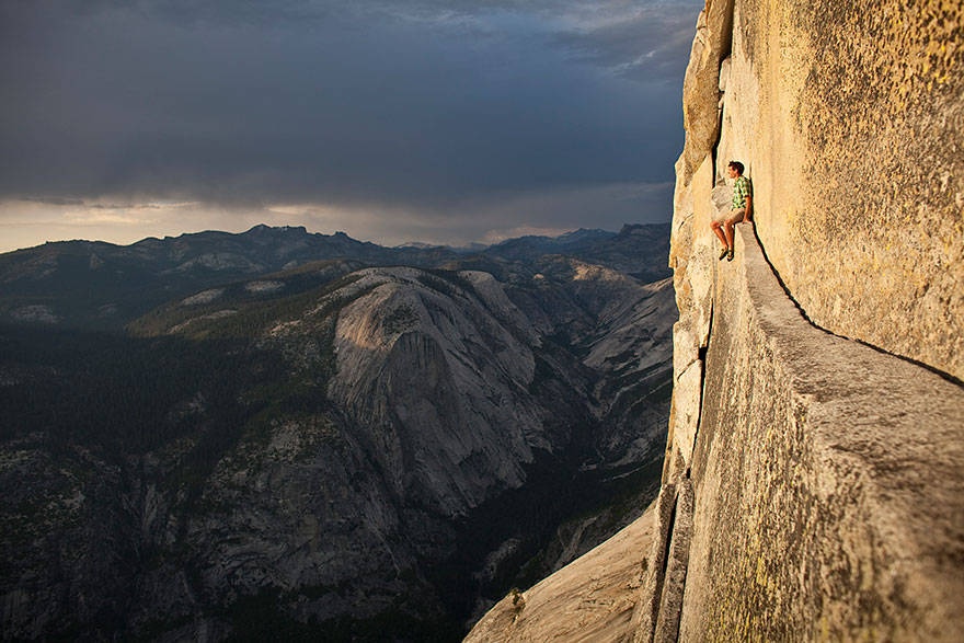 Alex honnold, one of the world's most daring free-climbers, resting in the middle of a climb.