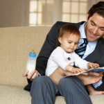 Father reading to daughter (15-18 months).