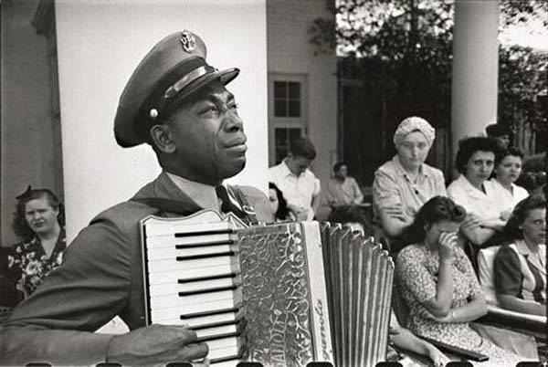 An accordion player mourning the death of FDR while playing at his funeral