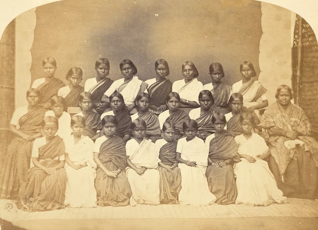 A group of 24 girls and their teacher at the london mission girls' Boarding School, Bangalore, taken by Henry Dixon in the 1860s