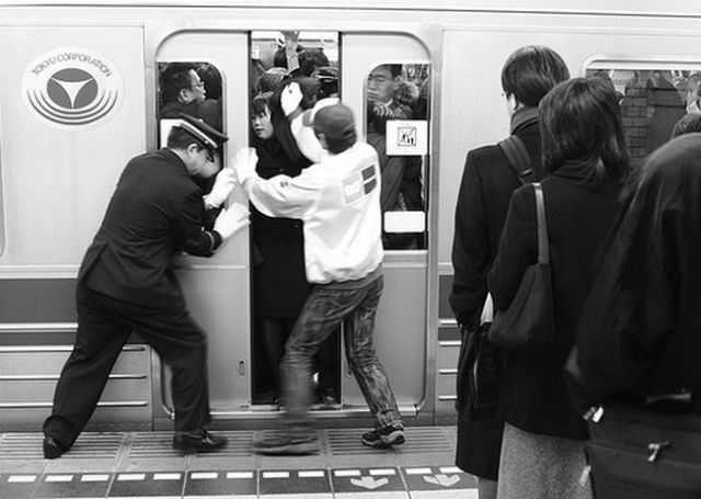 Japan, japanese train, japanese train pusher, pusher, asia, oshiya, weird, wtf, omg, railway system, tokyo, train pushers tokyo, railway station attendant