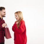 emotional-woman-receiving-gift-from-man