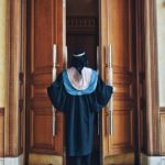 women entering graduation hall