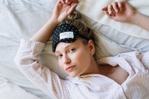 insomniac lady wearing eye mask