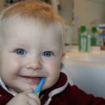 kid with toothbrush