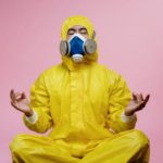 man doing yoga in mask