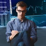 young man doing trade money calculation