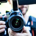 man with dslr camera