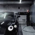 girl washing luxury car