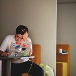 men wearing white tshirt coding