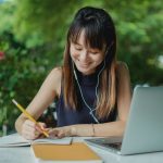 young girl writing essay