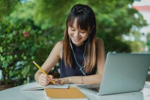 young girl writing essay