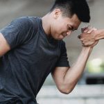 muscle sore one athlete helping another