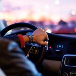 smart man driving car in city