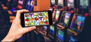 boy holding mobile phone, online slots