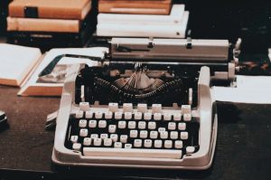 typewriter and books