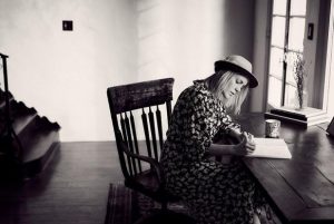 women writing in calm room
