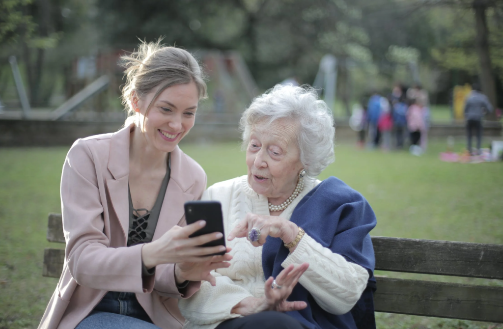 Grand mother and grand daughter playing online gaming