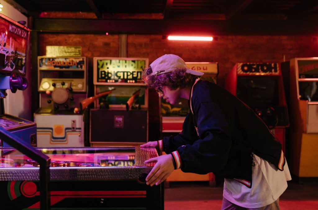 Young man playing on slots machine