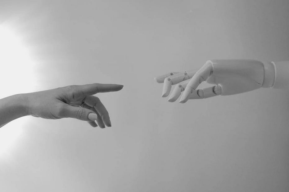 Robot and human hand try to touch each other