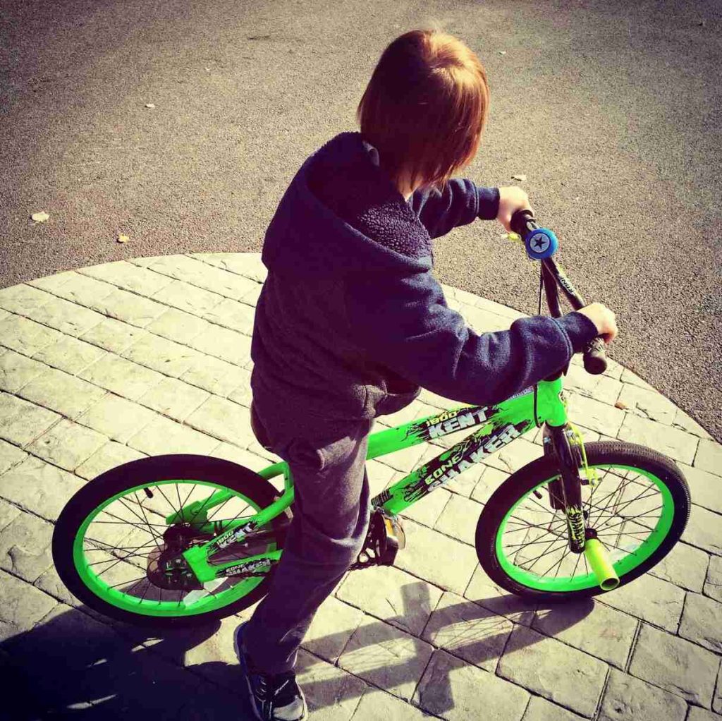 young kid on bicycle