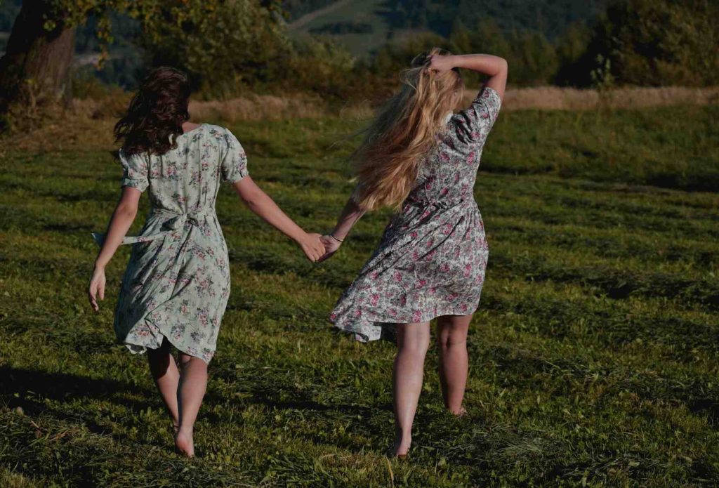 girls wearing floral dress walking