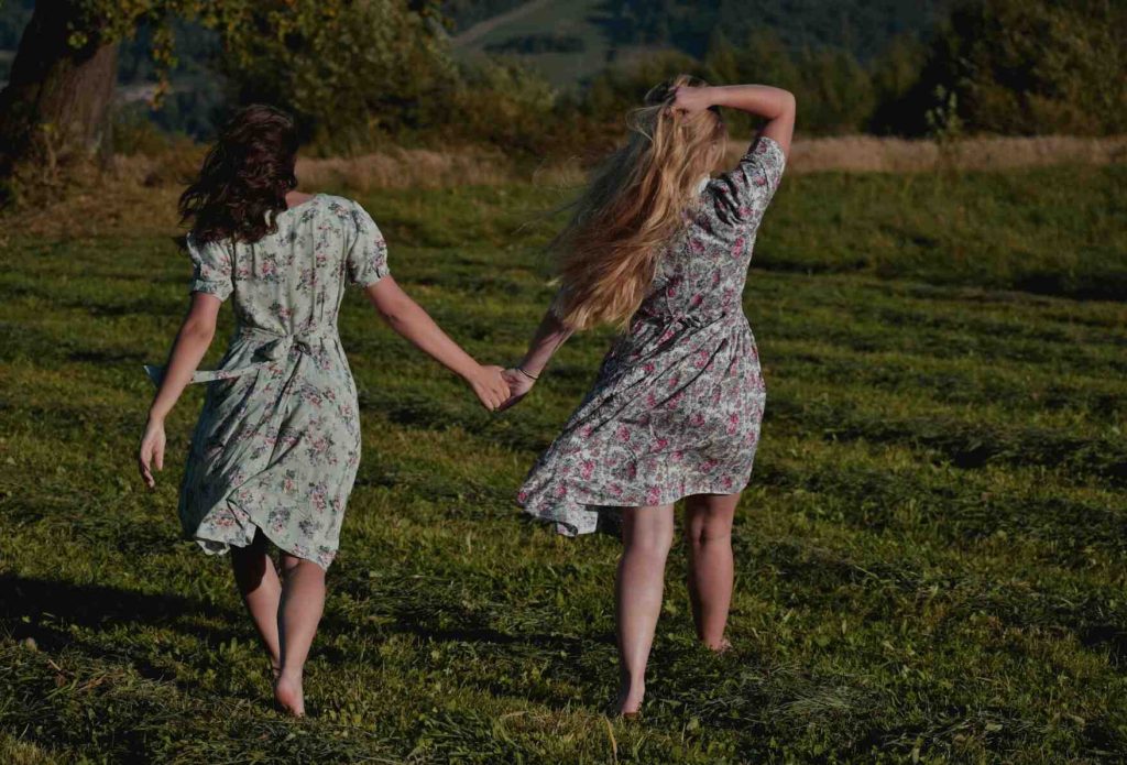 Girls wearing floral dress walking