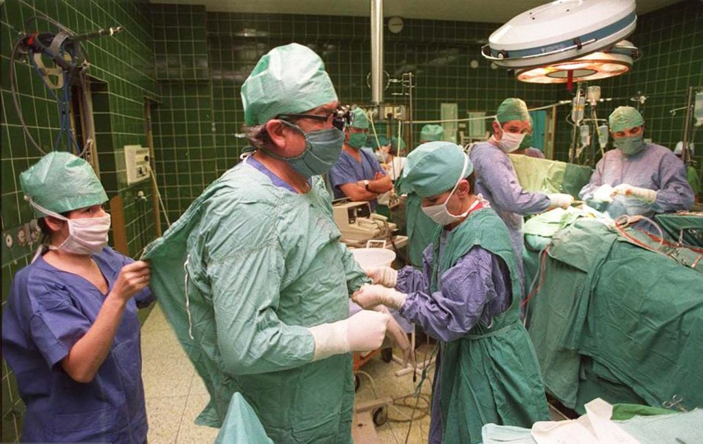 dr eliga getting his scrubs on before the operation